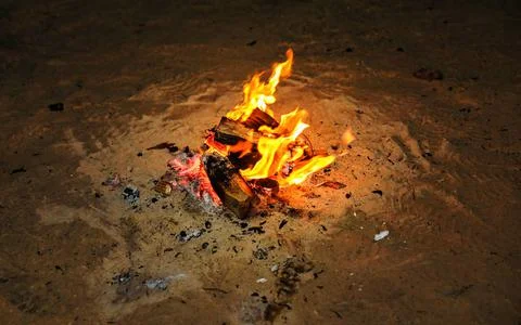Inviting campfire on the beach during the summer Stock Photos