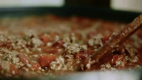 Inviting culinary study of steam rising from the red bean chili Stock Photos