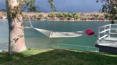 Inviting empty hammock next to the COLORADO RIVER near Parker, Arizona Video stock 153570749