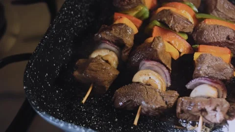 Inviting homemade meal: close view of juicy steak cubes on a skewer Stock Footage 342182133