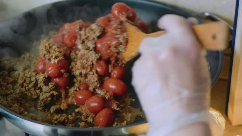 Inviting kitchen view: simmering a rich burrito filling Stock Footage 342167535