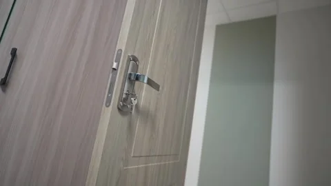 Inviting open doorway reveals glimpse of cozy dorm interior Vídeo Stock 311104971
