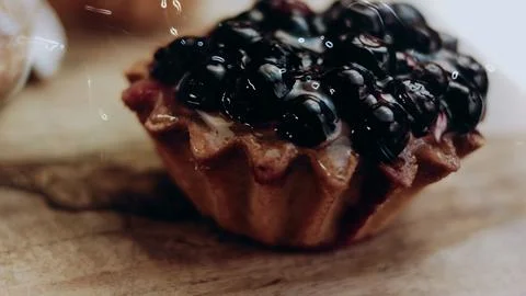 Inviting plating process view: revealing glossy fruit over pastry cream Stock Photos