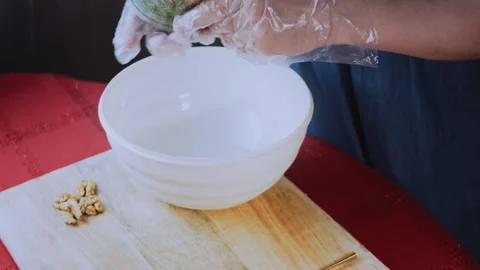 Inviting premium food angle: crushing walnuts for the mixture Stock Footage 342200102