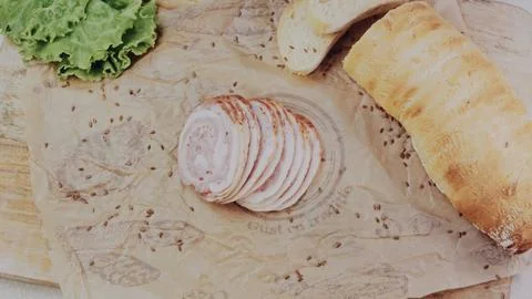 Inviting recipe demonstration: assembling a generous homemade sandwich Stock Photos
