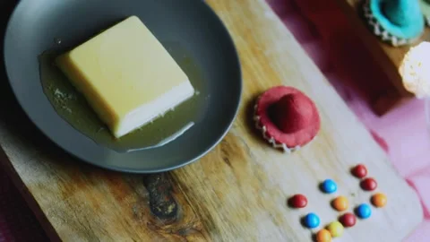 Inviting tabletop study of golden flan beauty shot on a wooden table Stock Footage 342154145