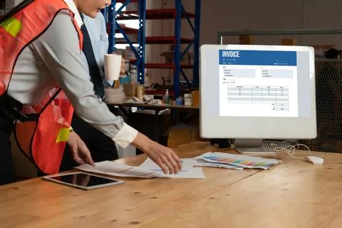 Invoice on computer screen from accounting application. Snugly. Stock Photos