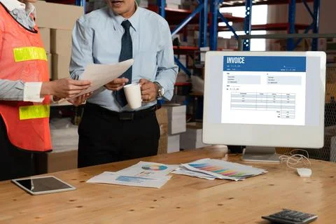 Invoice on computer screen from accounting application. Snugly. Stock Photos