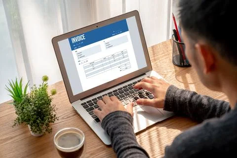 Invoice on computer screen from accounting application. Snugly. Stock Photos