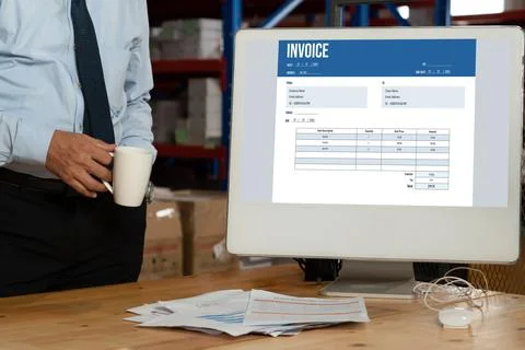 Invoice on computer screen from accounting application. Snugly. Stock Photos