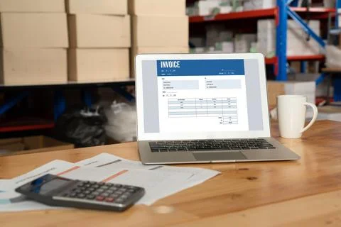 Invoice on computer screen from accounting application. Snugly. Stock Photos