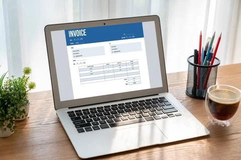 Invoice on computer screen from accounting application. Snugly. Stock Photos