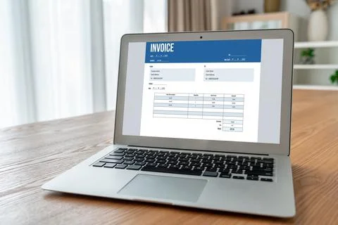Invoice on computer screen from accounting application. Snugly. Stock Photos