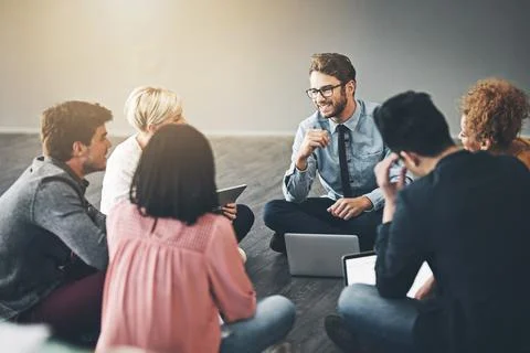 Involved to evolve. Shot of a diverse group of creative employees having a me Stock Photos