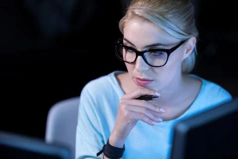 Involved female programmer practicing skills in the office Stock Photos