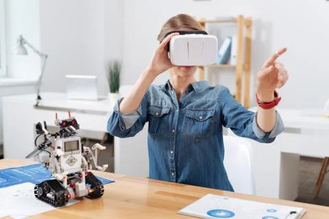 Involved volunteer testing visual reality headset in the lab 스톡 사진
