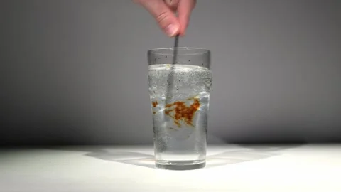 Iodine Cleared by Bleach in Water During Chemistry Experiment Stock Footage 324803266