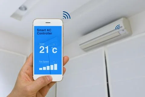 IOT Concept, Remotely Controlling Smart Air Conditioner with App on Smartphon Stock Photos