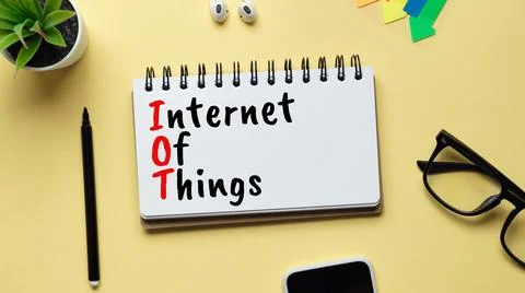 Iot or Internet of things concept. Inscription with a marker in a notebook. Stock Photos