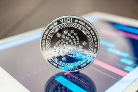Iota cryptocurrency on the tablet Stock Photos