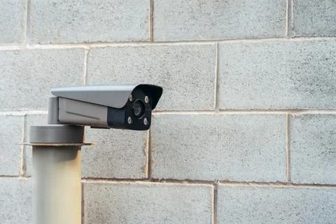 IP camera against a brick wall Stock Photos