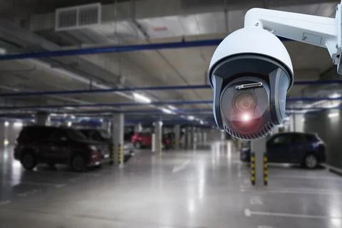 IP CCTV camera security protection system installing parking building car. Stock Photos