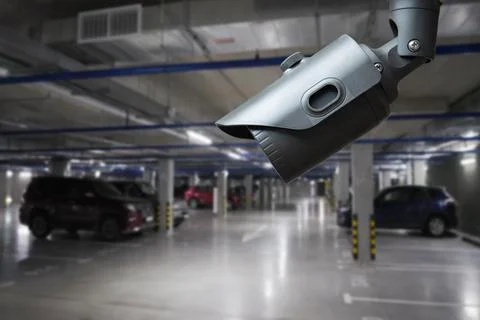 IP CCTV camera security protection system installing parking building car. Stock Photos