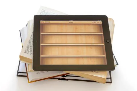 Ipad 3 with books application on opened books Фото