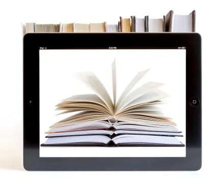 Ipad 3 with books background Stock Photos