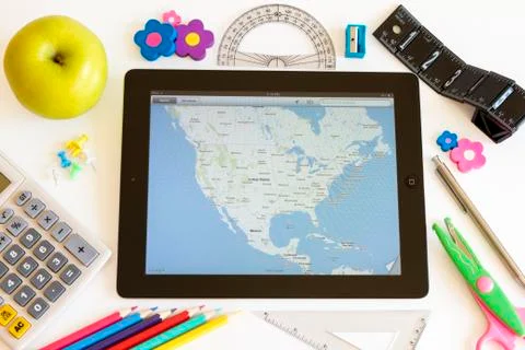 Ipad 3 with maps and school accesories 스톡 사진