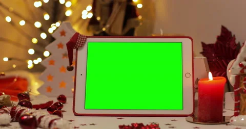 IPad Air with green screen on a background of Christmas tree and holiday lights. Stock Footage 144378865