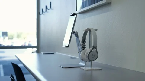 Ipad and beats sitting on desk, window in backround, apple, hd Stock Footage 124279448