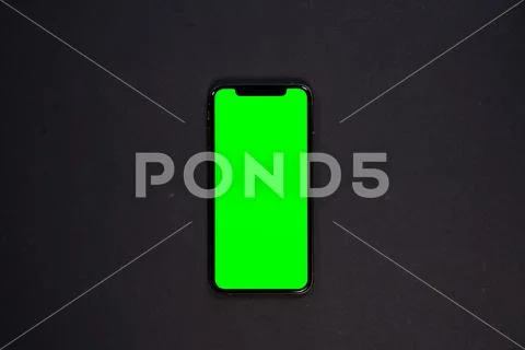 IPad and iPhone, on a black background, top view Stock Photos