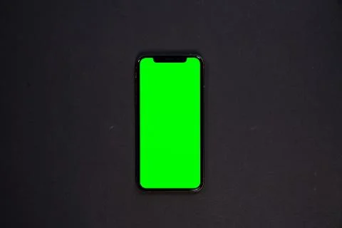 IPad and iPhone, on a black background, top view Stock Photos
