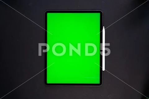 IPad and iPhone, on a black background, top view Stock Photos