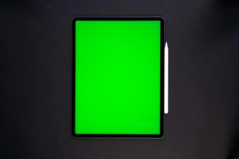 IPad and iPhone, on a black background, top view Stock Photos