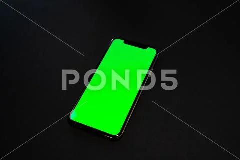 IPad and iPhone, on a black background, top view Stock Photos