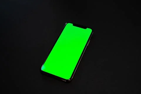 IPad and iPhone, on a black background, top view Stock Photos