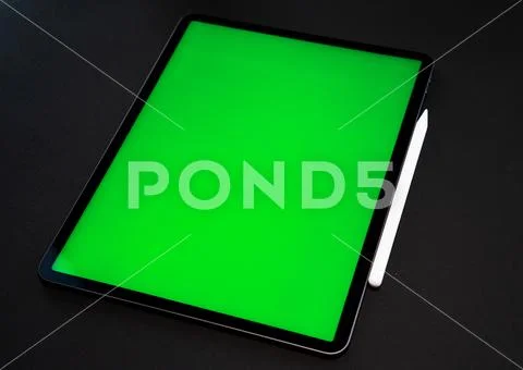 IPad and iPhone, on a black background, top view Stock Photos