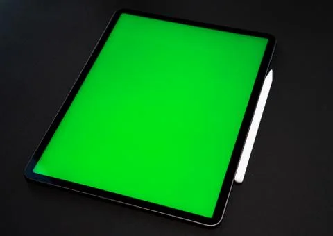 IPad and iPhone, on a black background, top view Stock Photos