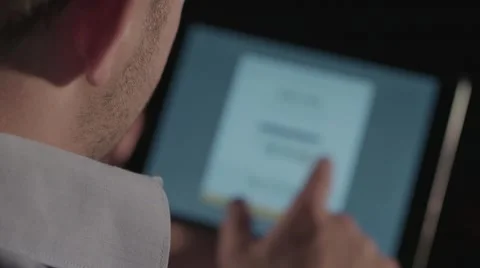 IPad Computer Tablet Touchscreen - Hand Gestures on Screen - Over Shoulder 1080p Stock Footage 52550547