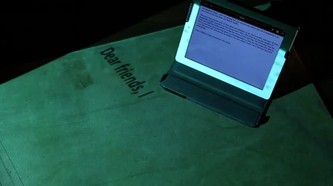 Ipad on desk from above with Bible passage projected Stock Footage 47487017