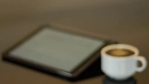 Ipad with full white coffee cup Stock Footage 74570483