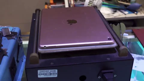 Ipad Glue softening machine for repairs,4K Video stock 315098604