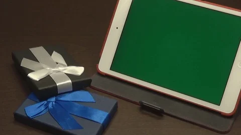 Ipad green screen with gifts Stock Footage 79550648