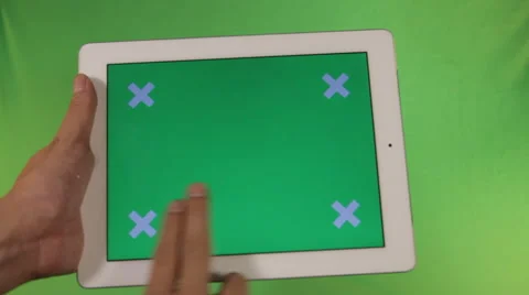 Ipad in the hands of a green screen with labels fingers Stock Footage 41087330