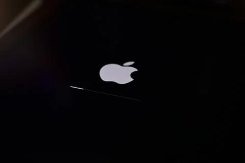 Ipad with Ipad OS 16 logo on the screen while updating to IOS16 screen close  Stock Photos