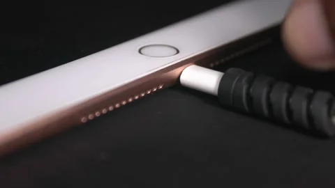 IPad lightning cable remove easily by hand Stock Footage 166822740