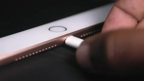 IPad lightning cable remove easily by hand Stock Footage 166822747