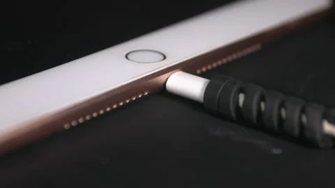IPad lightning cable remove easily by hand with struggling Stock Footage 166822748